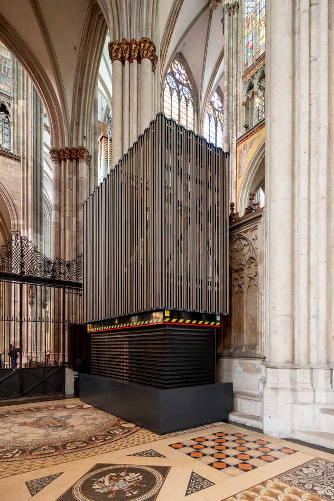 Scissor lift raises the organ into position.